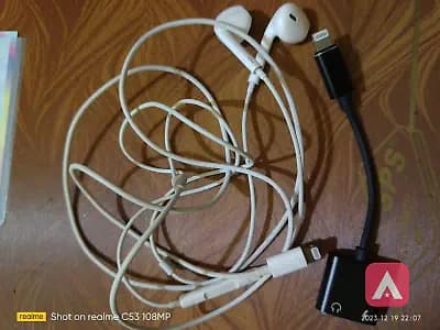 apple earpods and charger connected